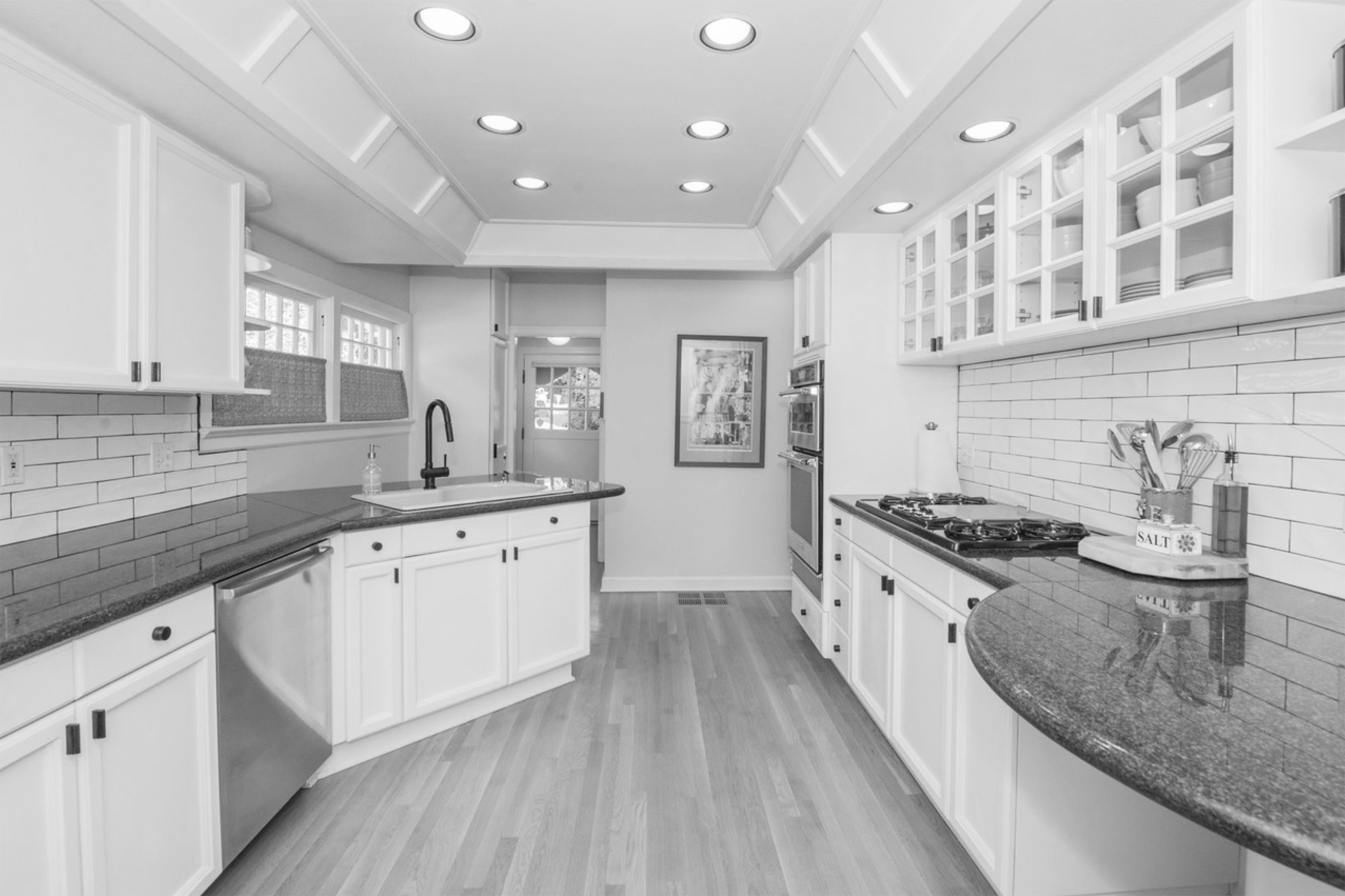 Existing kitchen before remodel showing dated galley layout with small peninsula and no connection to dining room, Arlington Heights Remodel by Tweto Architecture