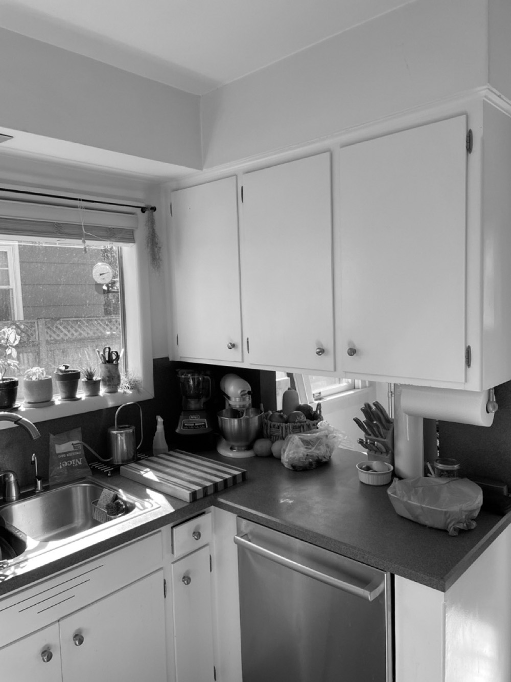 Original cramped kitchen with white painted cabinets and small window before the remodel, Concordia Kitchen