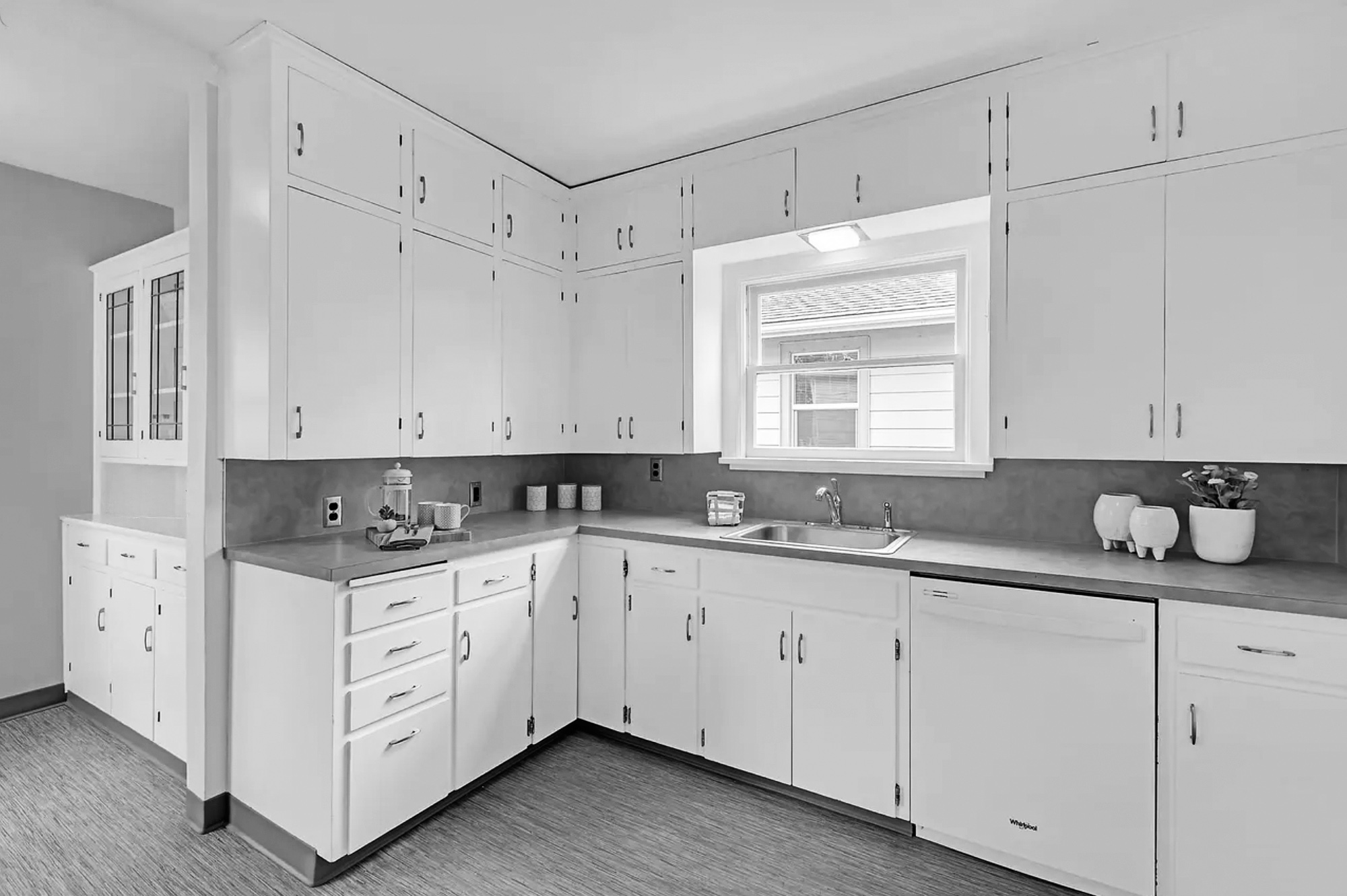 Existing kitchen before the remodel with painted cabinets, upper cabinets on every wall, and a small window over the sink, Rose City Kitchen