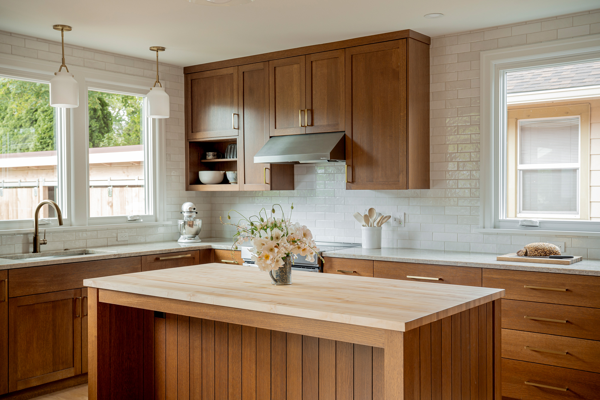 Remodeled kitchen with white oak island, quartzite counters, zellige tile, and new windows on two walls, Rose City Kitchen by Tweto Architecture
